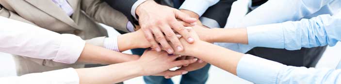 Keyland Polymer staff hands in a pile